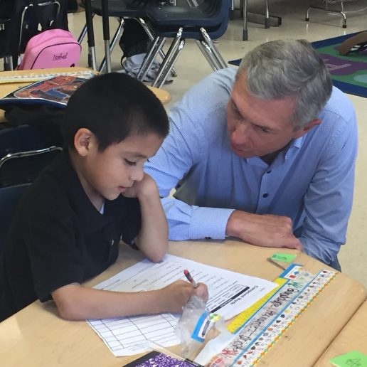 teacher helping student do work